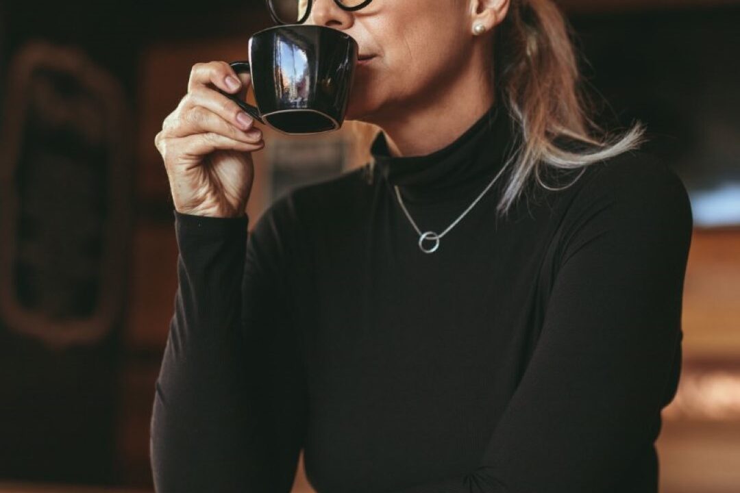 a woman drinking coffee