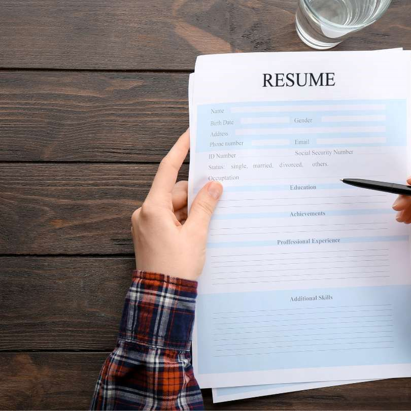 A person updating their resume