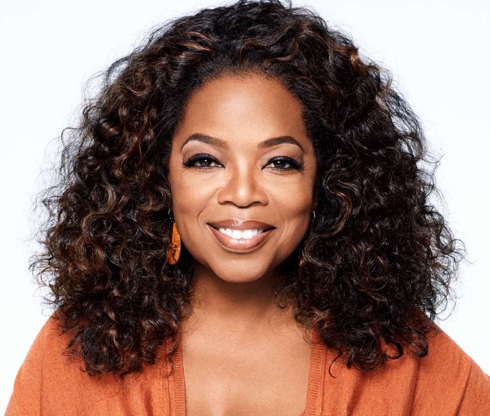 A picture of Oprah Winfrey, smiling and looking confident